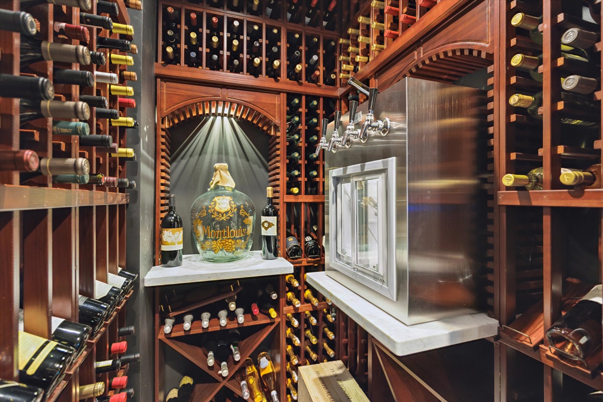 2249 Pelham Drive Houston, TX 77019 - Photo 11 of 50 Climate-controlled wine room with abundant storage, custom woodwork, and wine-on-tap service.