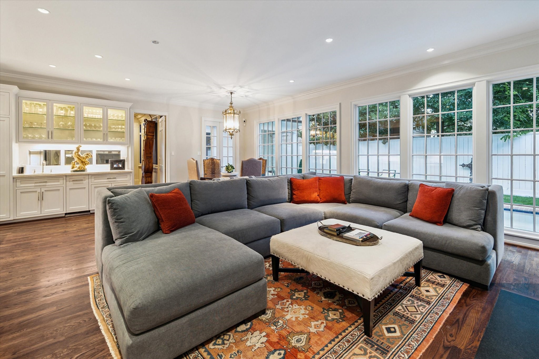 2249 Pelham Drive Houston, TX 77019 - Photo 20 of 50 Comfortable living space with walls of windows and open-concept layout.