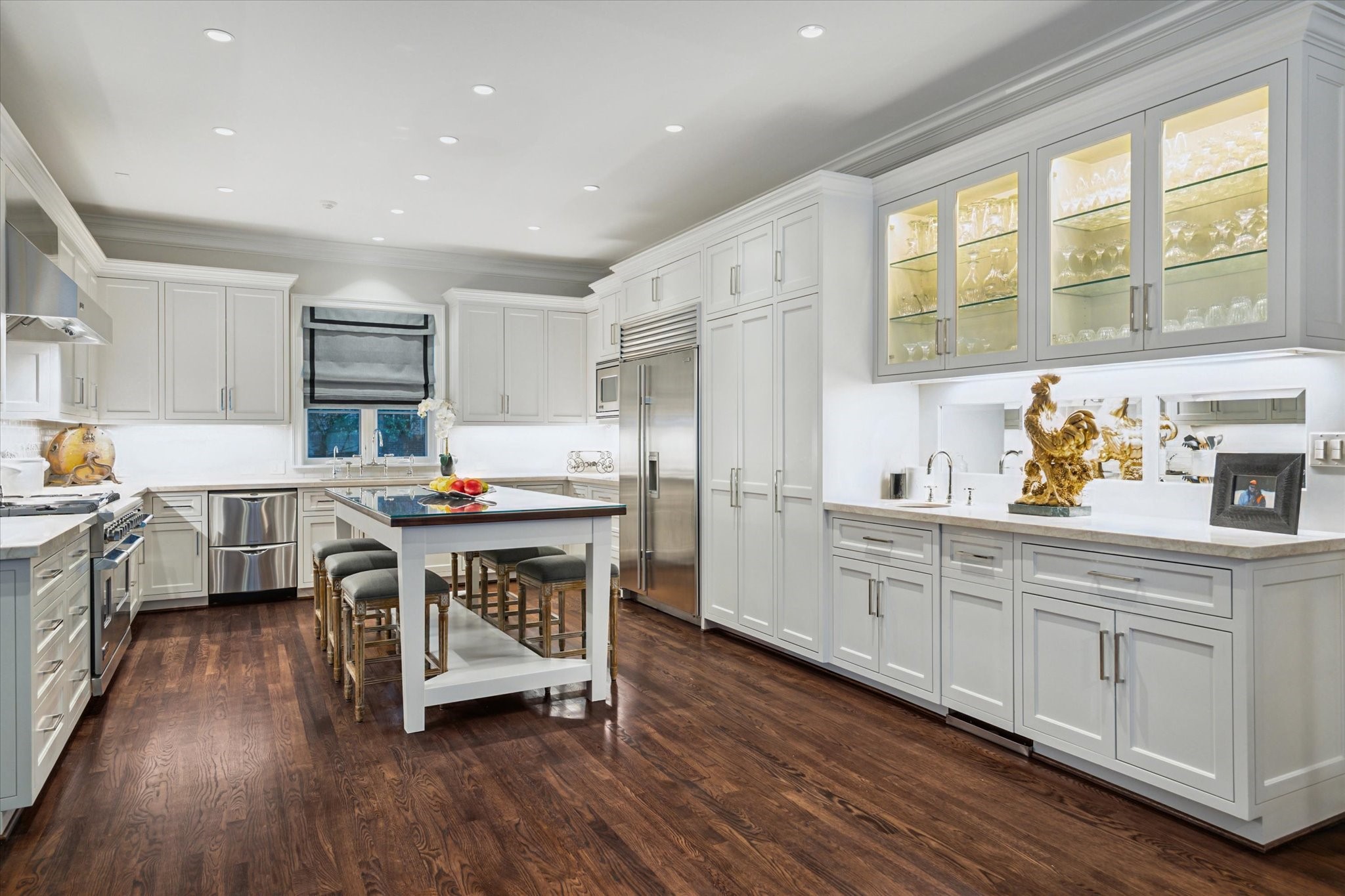 2249 Pelham Drive Houston, TX 77019 - Photo 22 of 50 Chef’s kitchen featuring custom cabinetry, marble countertops, and professional-grade appliances.