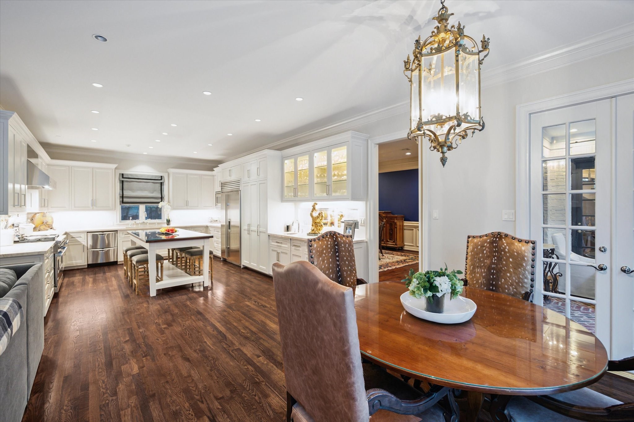 2249 Pelham Drive Houston, TX 77019 - Photo 26 of 50 Gather around the island or the breakfast table—this space was made for connection.
