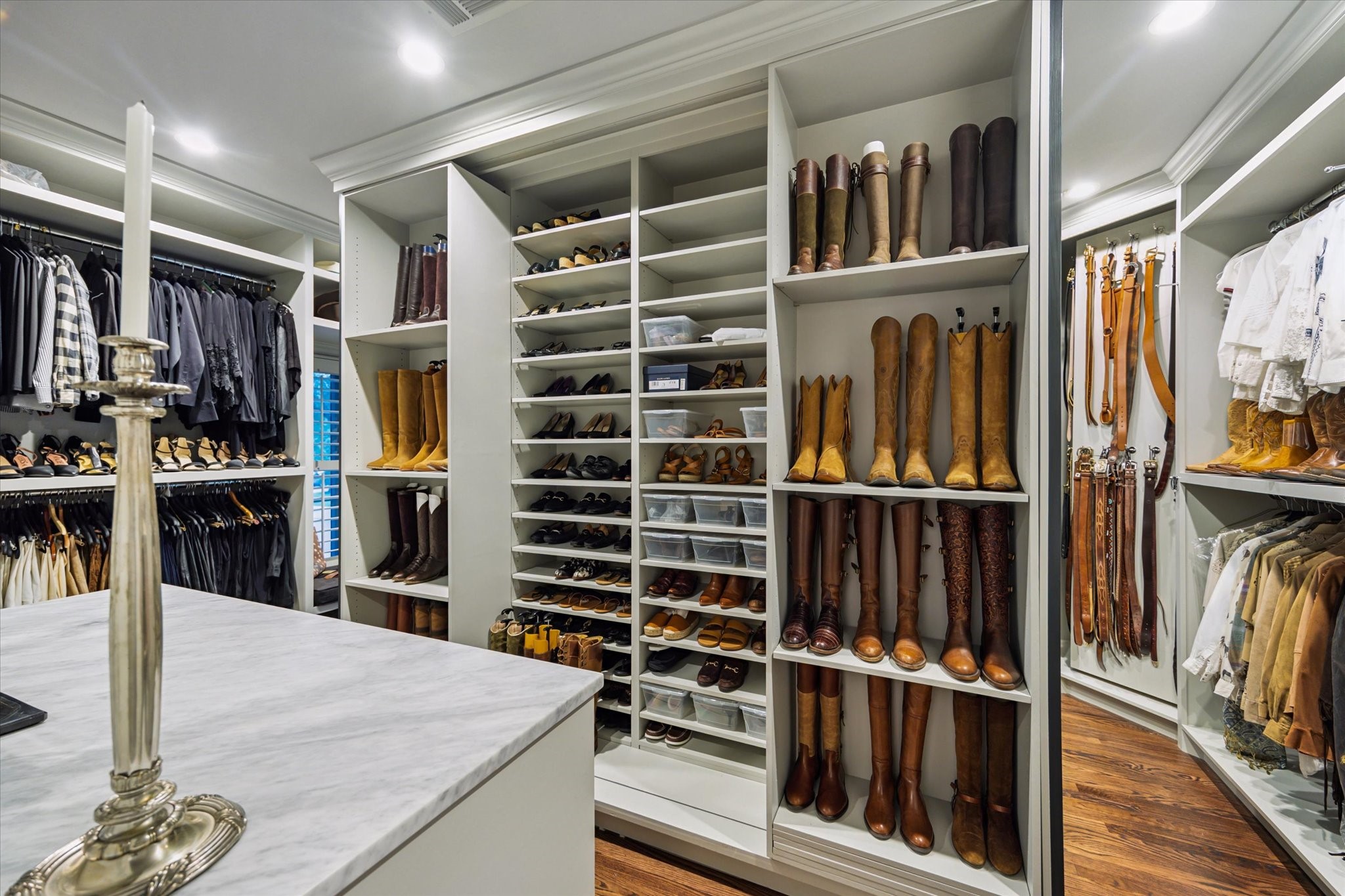 2249 Pelham Drive Houston, TX 77019 - Photo 36 of 50 Expansive walk-in closet with custom shelving, storage island, and built-ins.