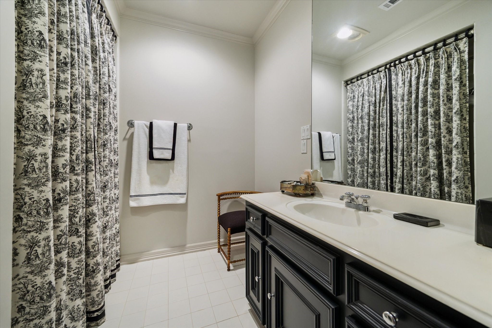 2249 Pelham Drive Houston, TX 77019 - Photo 39 of 50 Secondary bathroom with classic vanity and coordinating toile shower drapery.