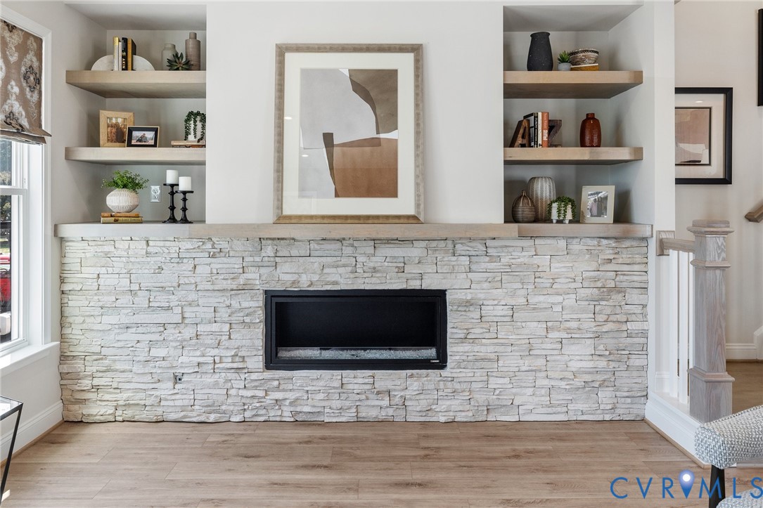 16104 Esteem Way Midlothian, VA 23113 - Photo 15 of 38 a living room with a bookshelf and a fireplace