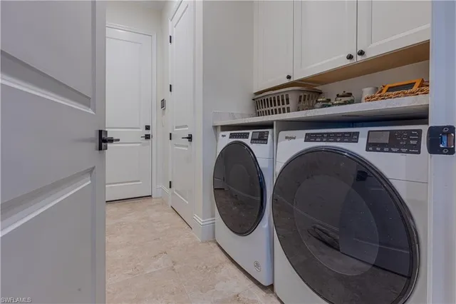 a close view of utility room with washer and dryer