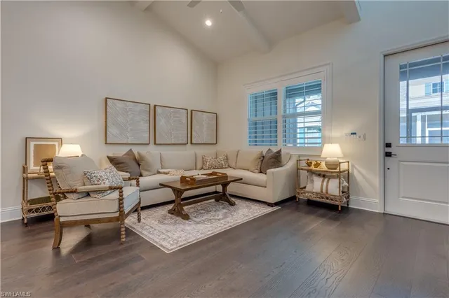 a living room with furniture and a lamp