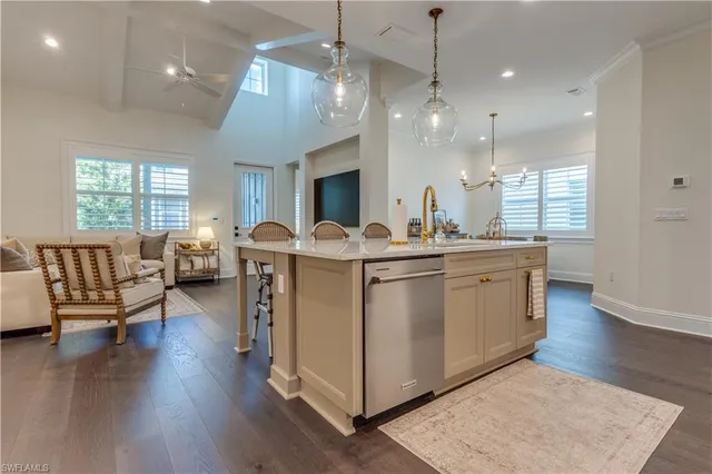 a view of living room kitchen with furniture and wooden floor
