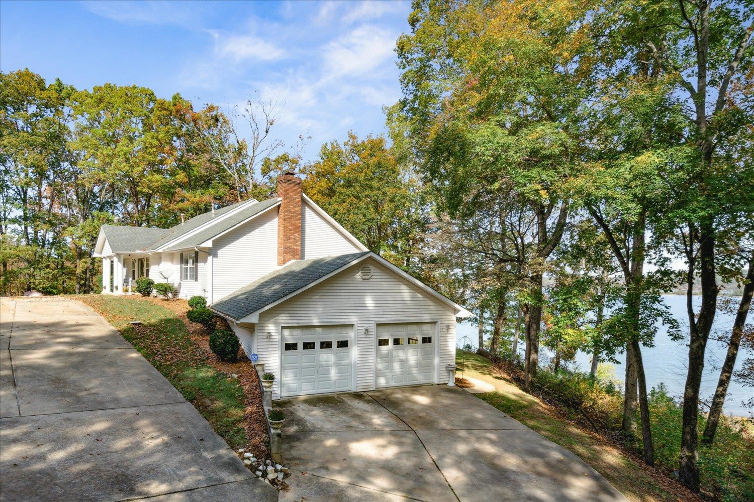 997 Vickers Road Big Sandy, TN 38221 - Photo 28 of 40 a view of a house with a yard