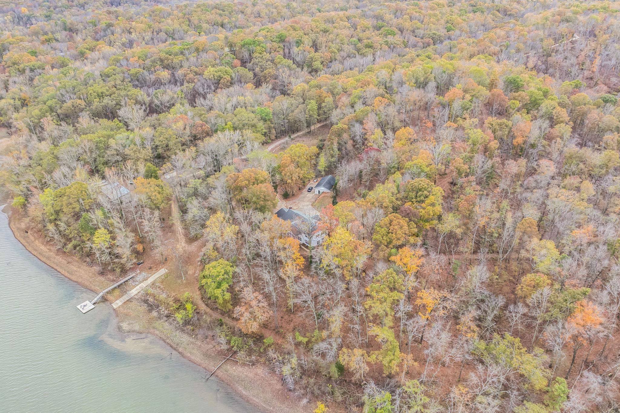 997 Vickers Road Big Sandy, TN 38221 - Photo 35 of 40 a view of a yard with a tree