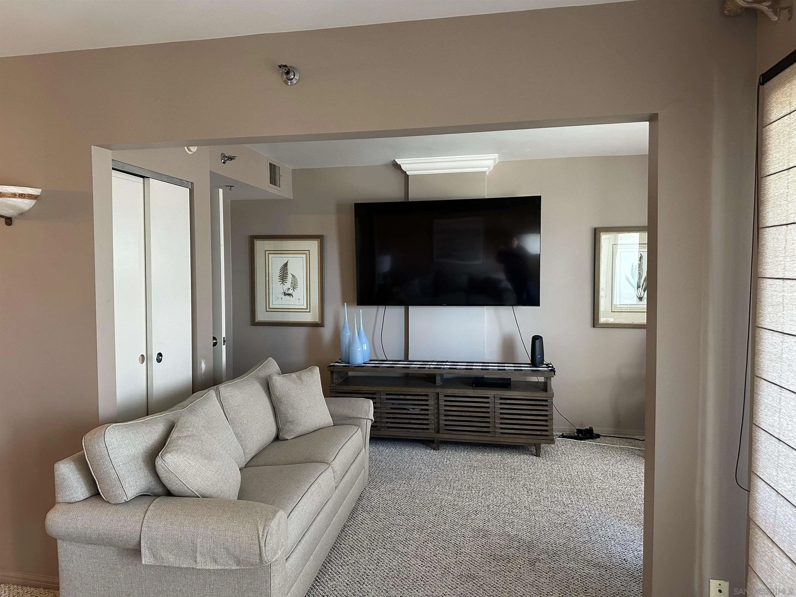 525 East Seaside Way, Unit 1607 Long Beach, CA 90802 - Photo 13 of 41 a living room with furniture and a flat screen tv