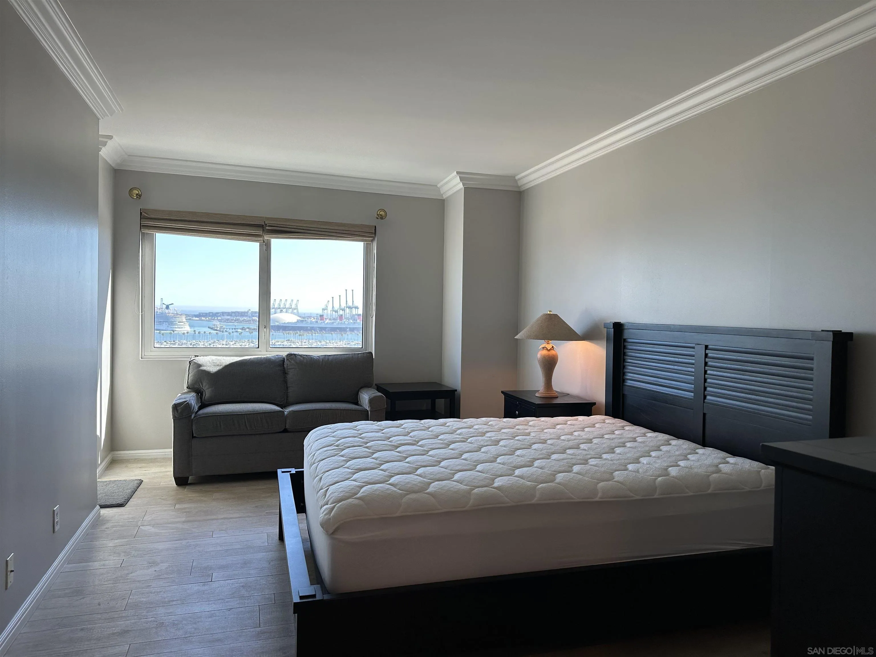 525 East Seaside Way, Unit 1607 Long Beach, CA 90802 - Photo 25 of 41 a bedroom with a bed and a couch