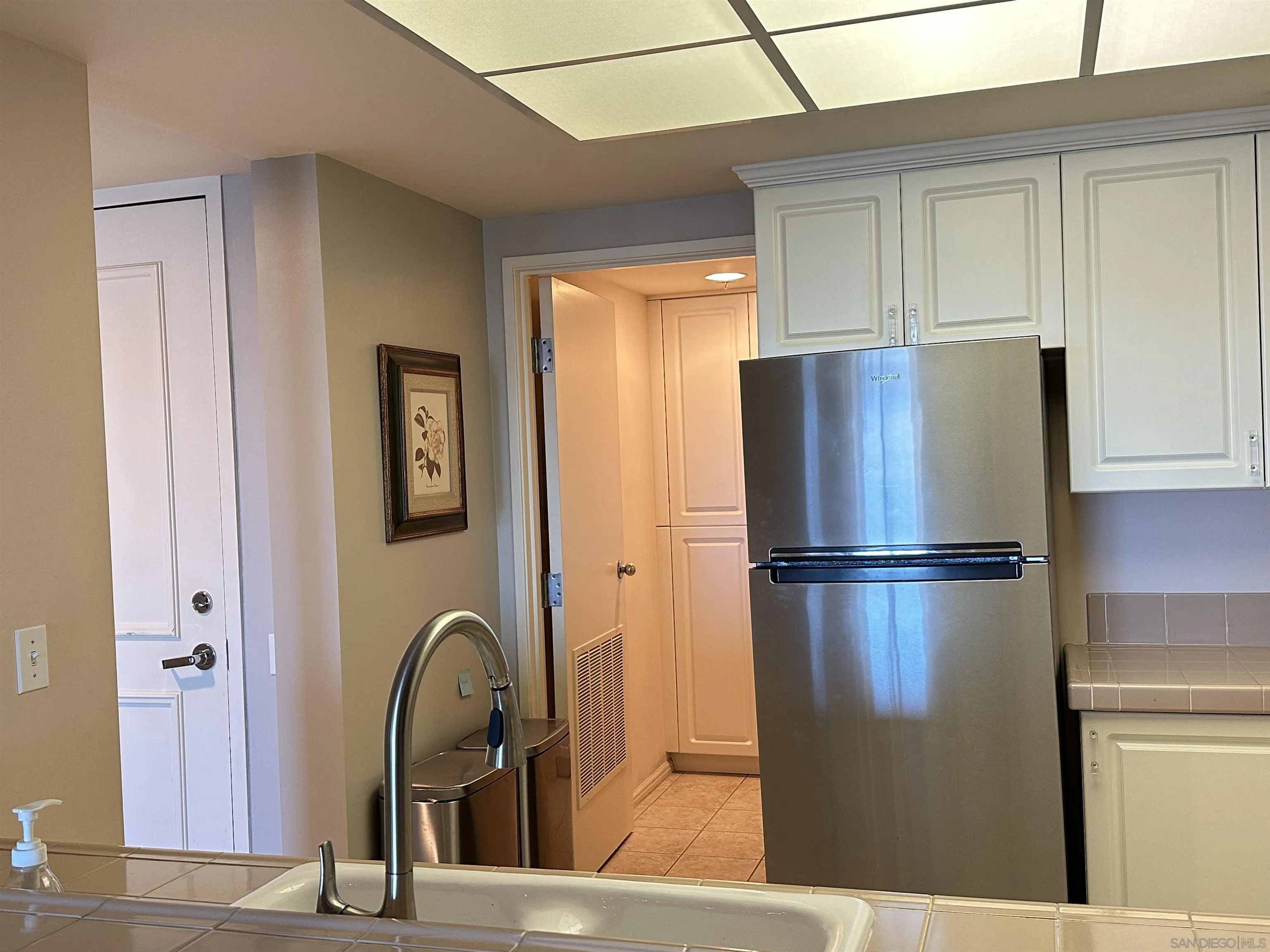 525 East Seaside Way, Unit 1607 Long Beach, CA 90802 - Photo 6 of 41 a kitchen with a refrigerator and countertop