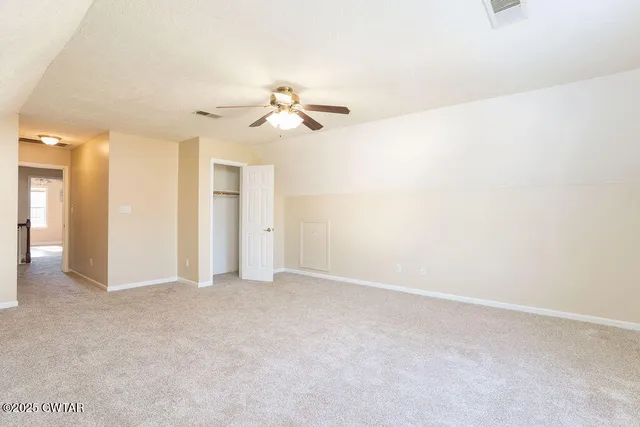a view of a big room with carpet