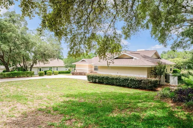 a view of a house with a garden and yard