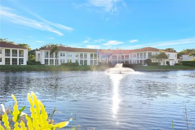 a view of a lake with buildings