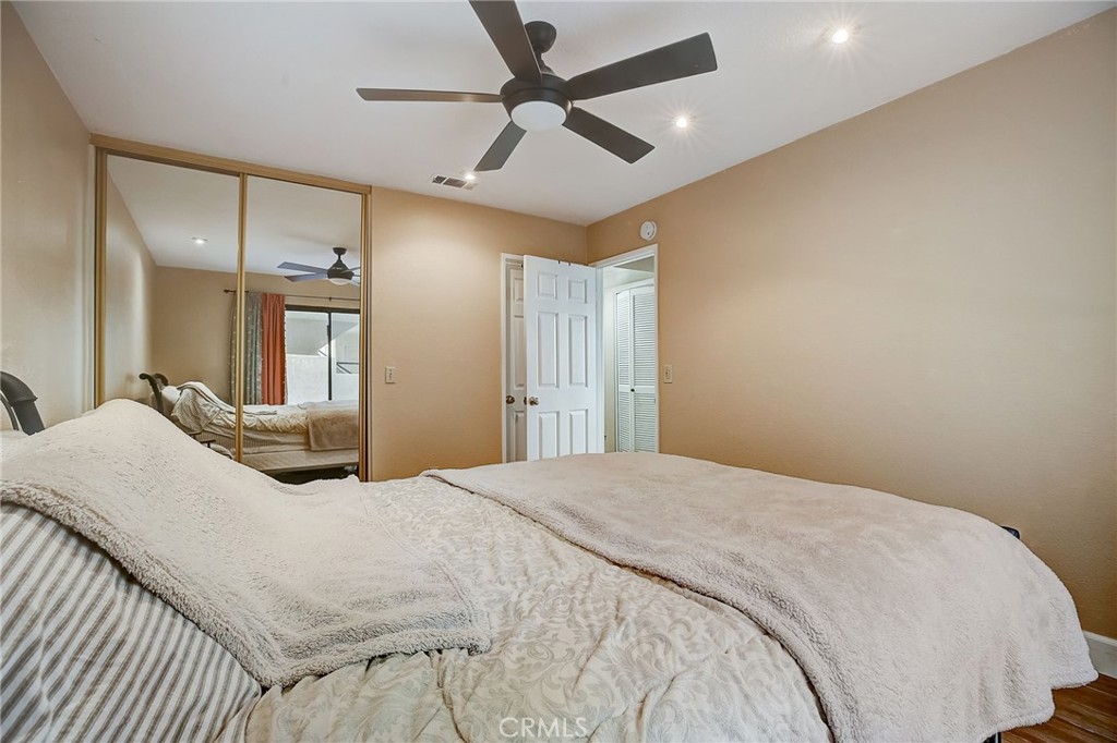 23 Pearl Laguna Niguel, CA 92677 - Photo 16 of 37 a bedroom with a large bed and a chandelier