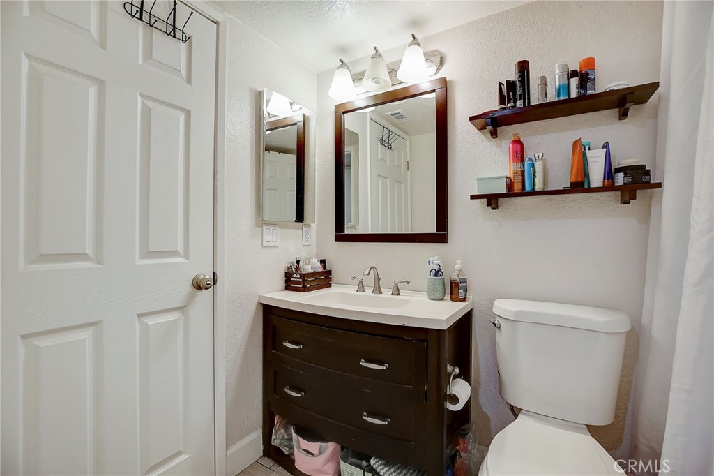 23 Pearl Laguna Niguel, CA 92677 - Photo 18 of 37 a bathroom with a toilet sink and mirror