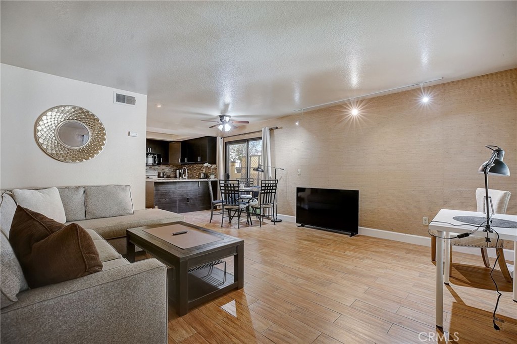 23 Pearl Laguna Niguel, CA 92677 - Photo 2 of 37 a living room with furniture and a wooden floor