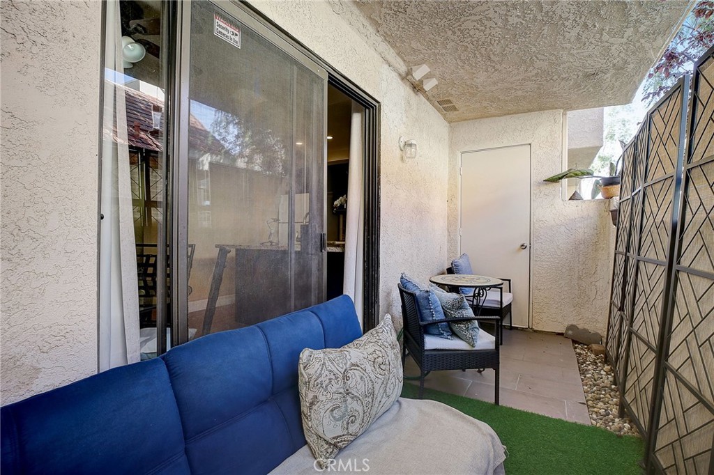 23 Pearl Laguna Niguel, CA 92677 - Photo 21 of 37 a living room with furniture and a glass door