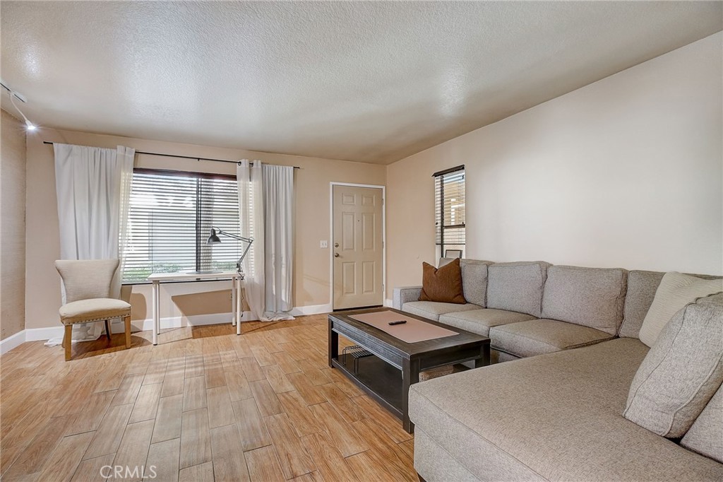 23 Pearl Laguna Niguel, CA 92677 - Photo 5 of 37 a living room with furniture and wooden floor