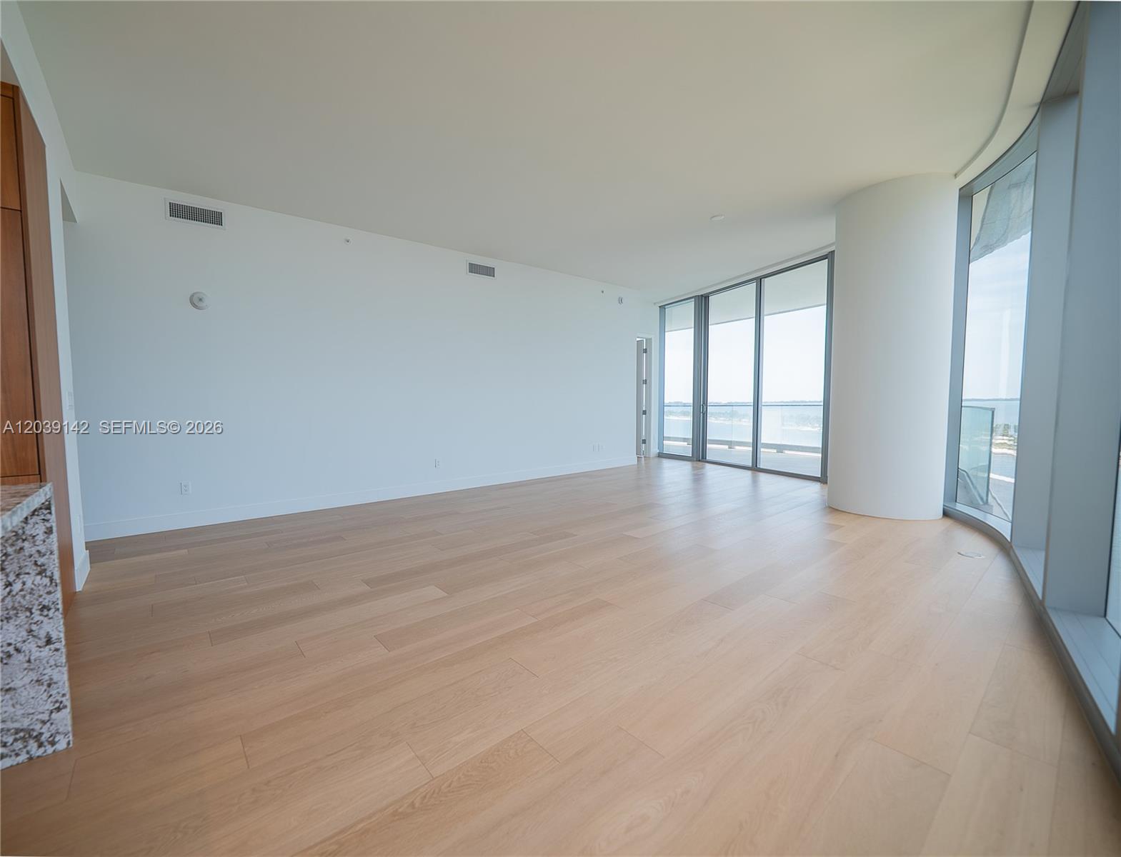 175 Southeast 25th Road, Unit 702 Miami, FL 33129 - Photo 1 of 30 wooden floor in an empty room with a window