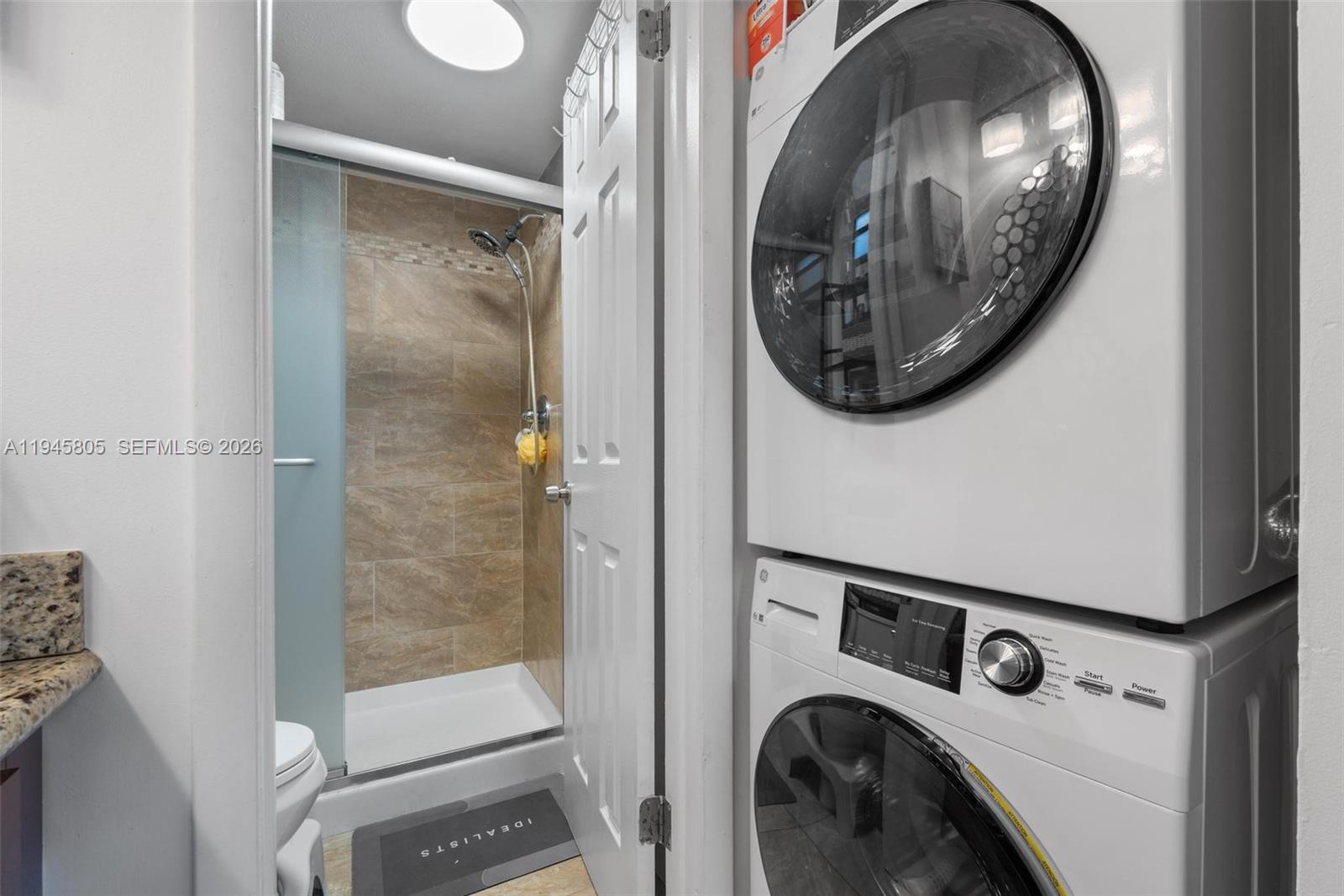 10005 Winding Lake Road, Unit 106 Sunrise, FL 33351 - Photo 18 of 41 a view of bathroom with washer and dryer