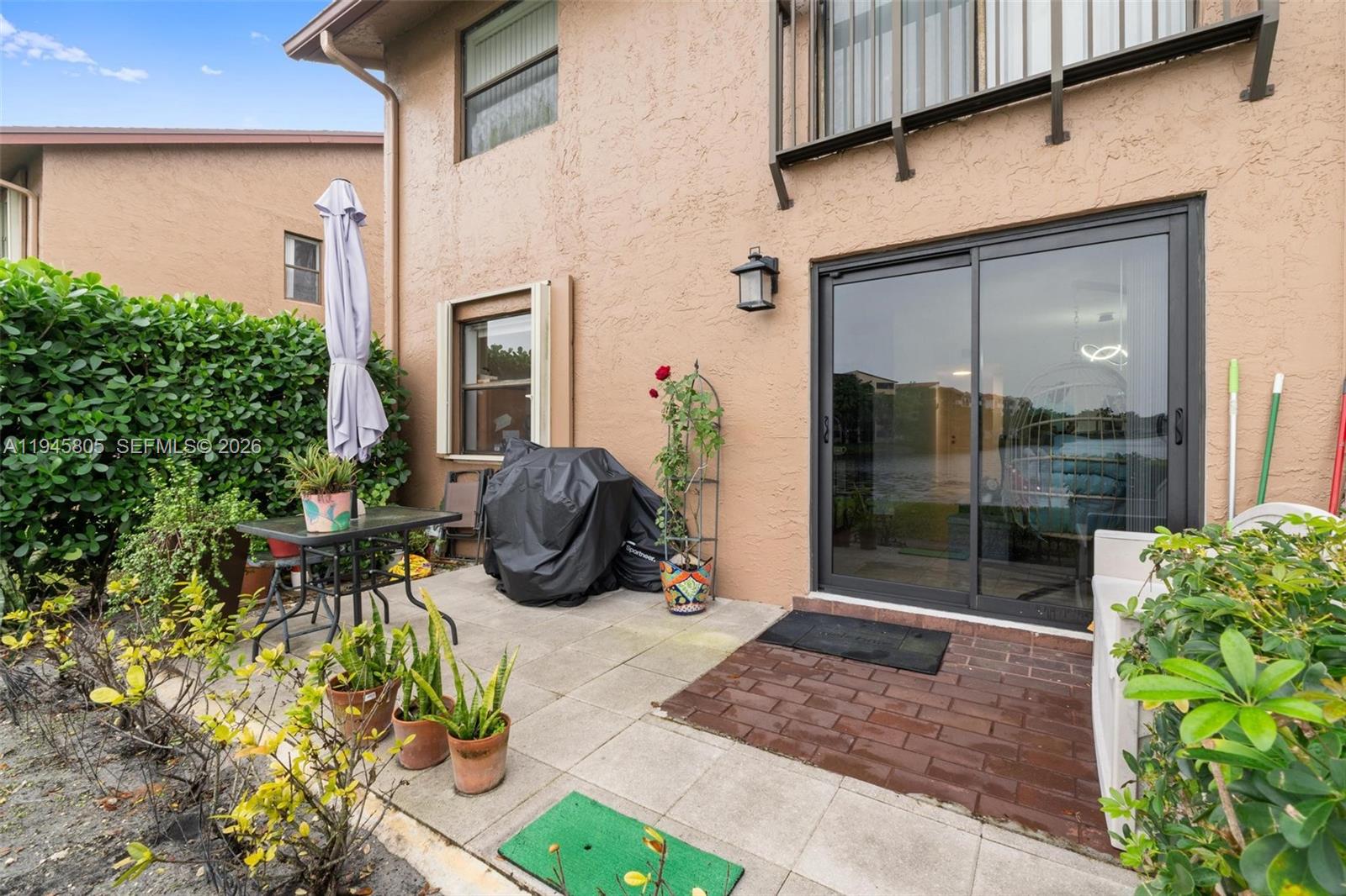 10005 Winding Lake Road, Unit 106 Sunrise, FL 33351 - Photo 25 of 41 a view of backyard of the house