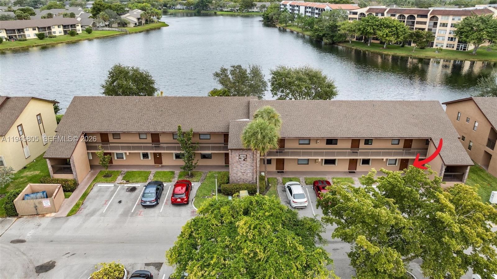 10005 Winding Lake Road, Unit 106 Sunrise, FL 33351 - Photo 29 of 41 an aerial view of a house with a lake view