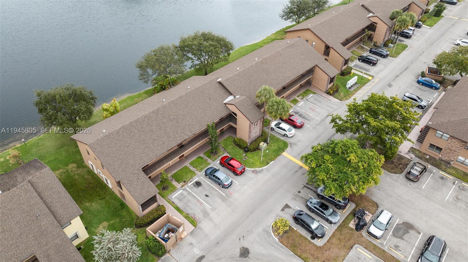 10005 Winding Lake Road, Unit 106 Sunrise, FL 33351 - Photo 32 of 41 an aerial view of a house with a yard and outdoor seating