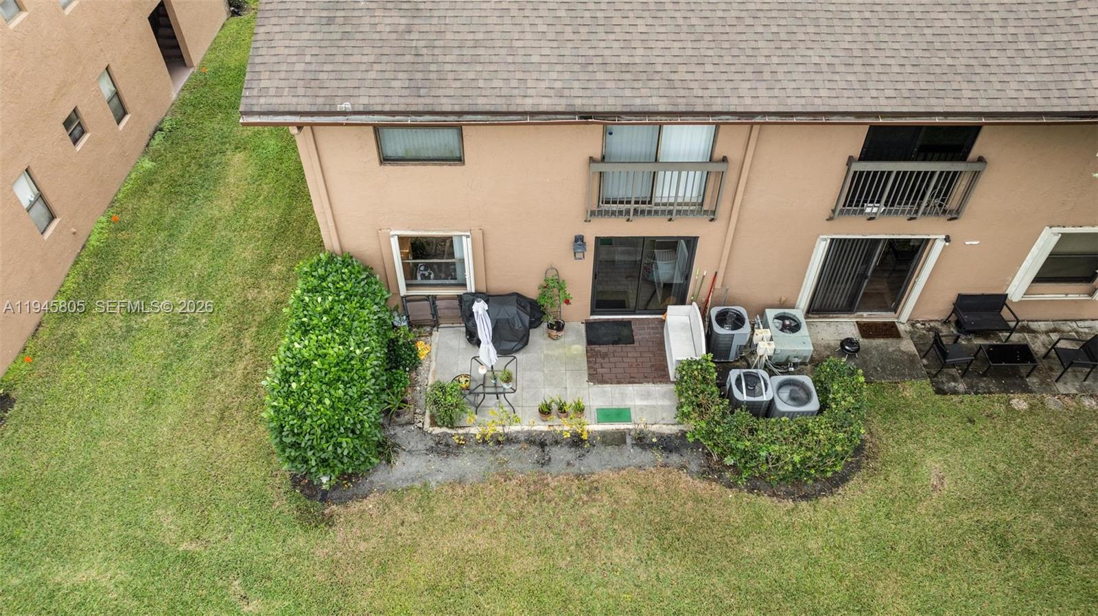 10005 Winding Lake Road, Unit 106 Sunrise, FL 33351 - Photo 36 of 41 a view of a house with backyard