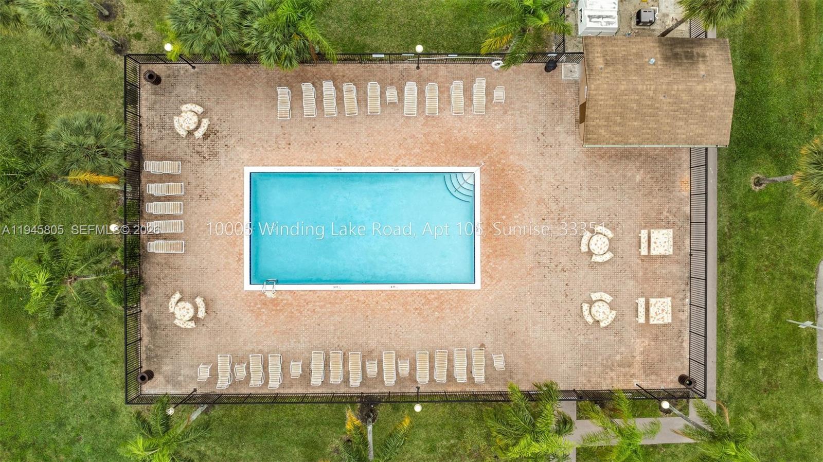 10005 Winding Lake Road, Unit 106 Sunrise, FL 33351 - Photo 39 of 41 a front view of a house with a yard