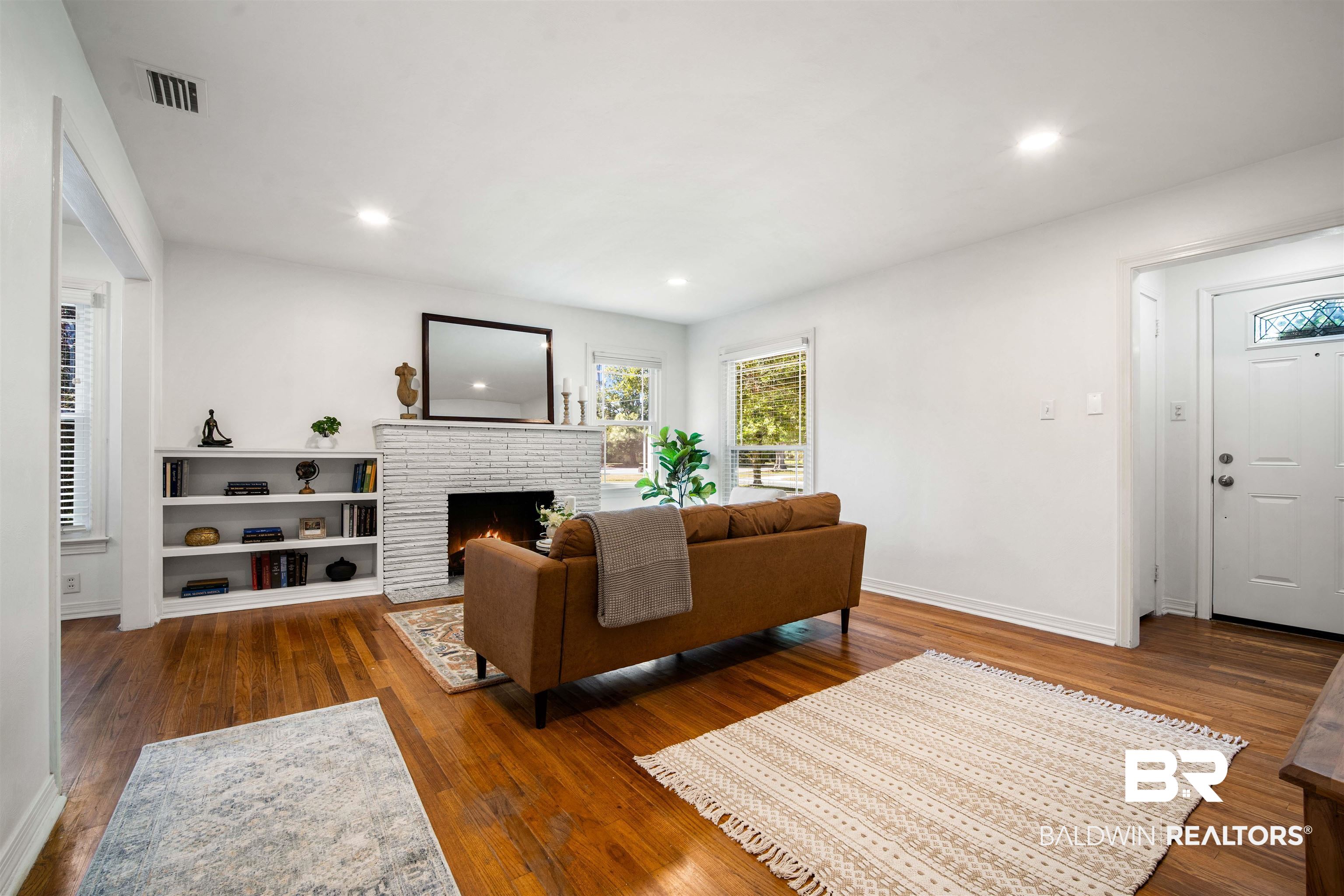 2615 Walton Avenue Mobile, AL 36606 - Photo 6 of 33 Living area featuring hardwood / wood-style flooring, recessed lighting, visible vents, baseboards, and a brick fireplace