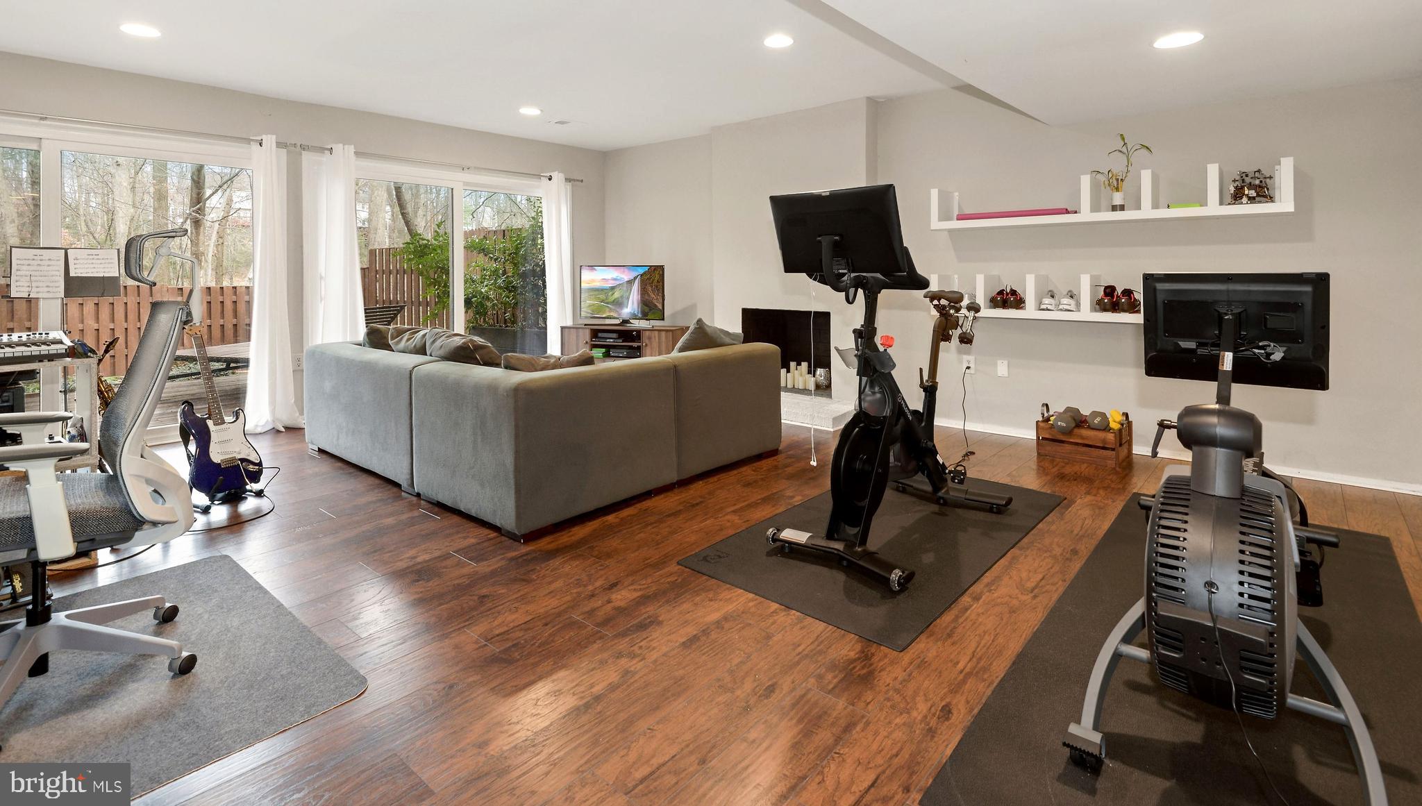 11642 Mediterranean Court Reston, VA 20190 - Photo 22 of 42 Lower-level Family Room walk-out with fireplace