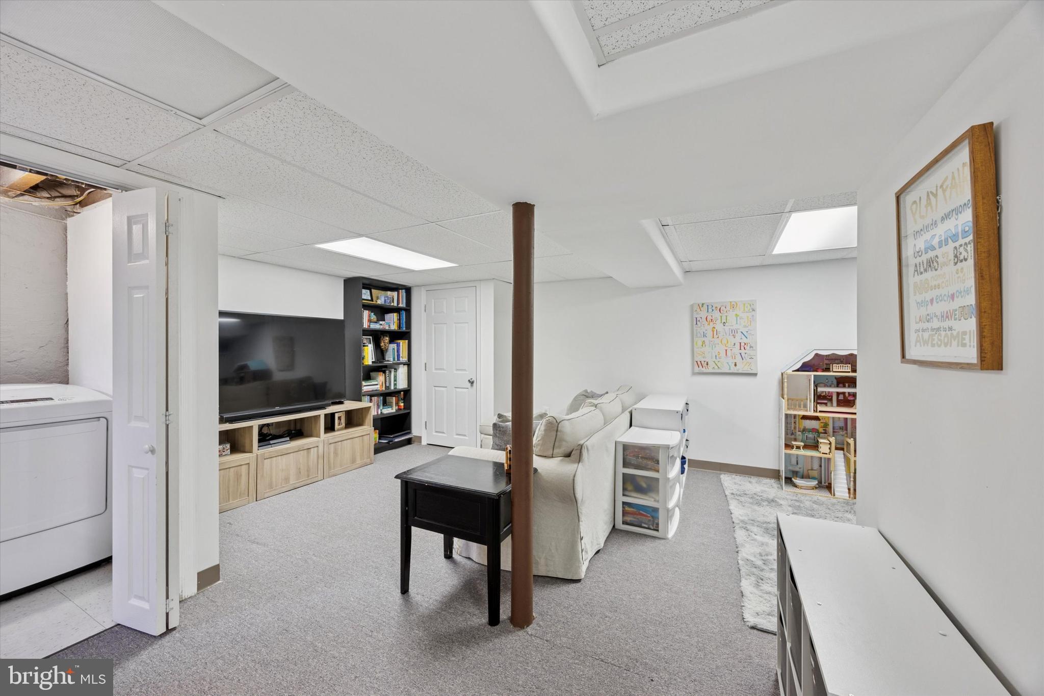 256 Ridgewood Road Springfield, PA 19064 - Photo 14 of 32 a living room with furniture and a flat screen tv