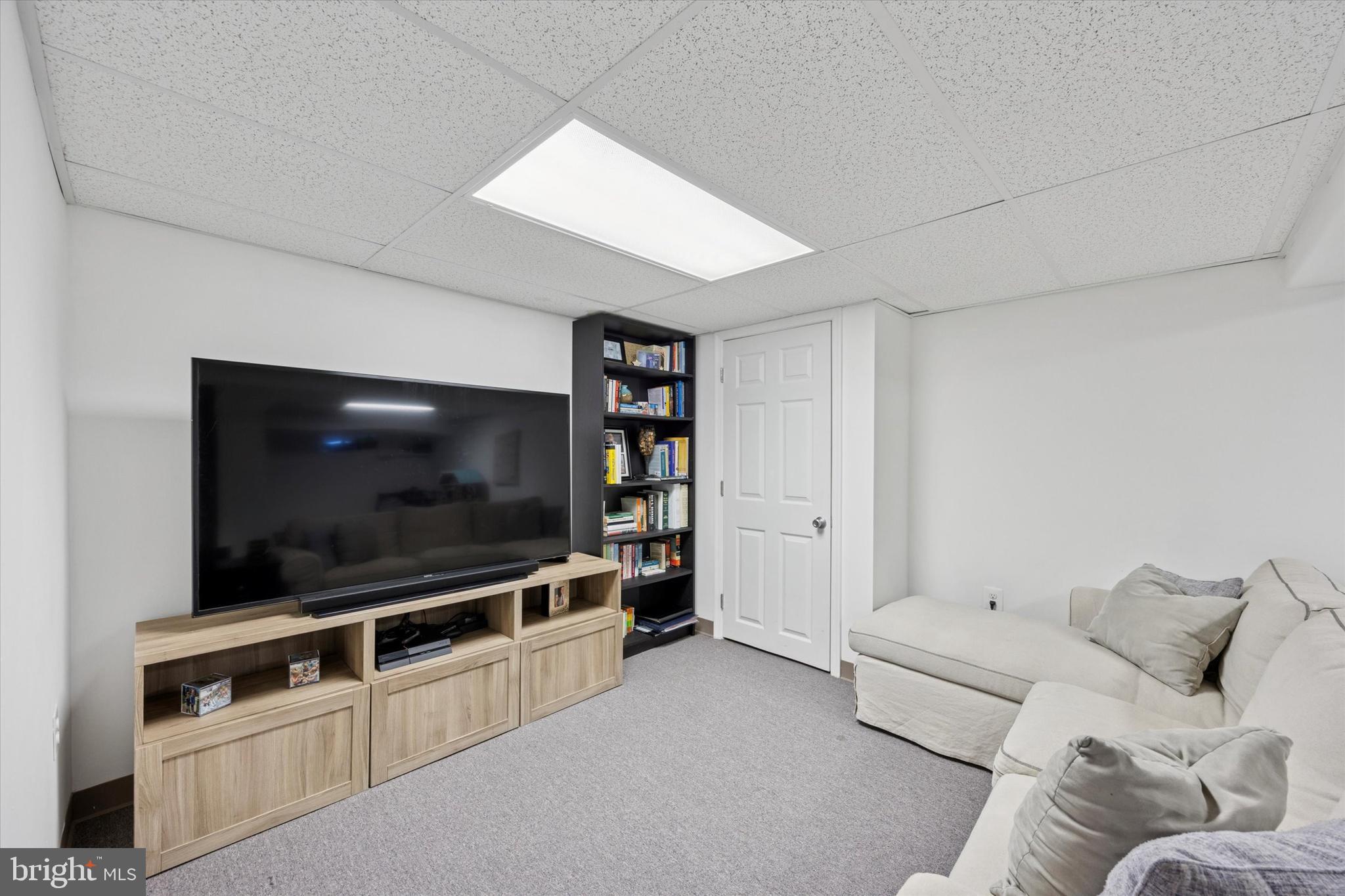 256 Ridgewood Road Springfield, PA 19064 - Photo 15 of 32 a living room with furniture and a flat screen tv