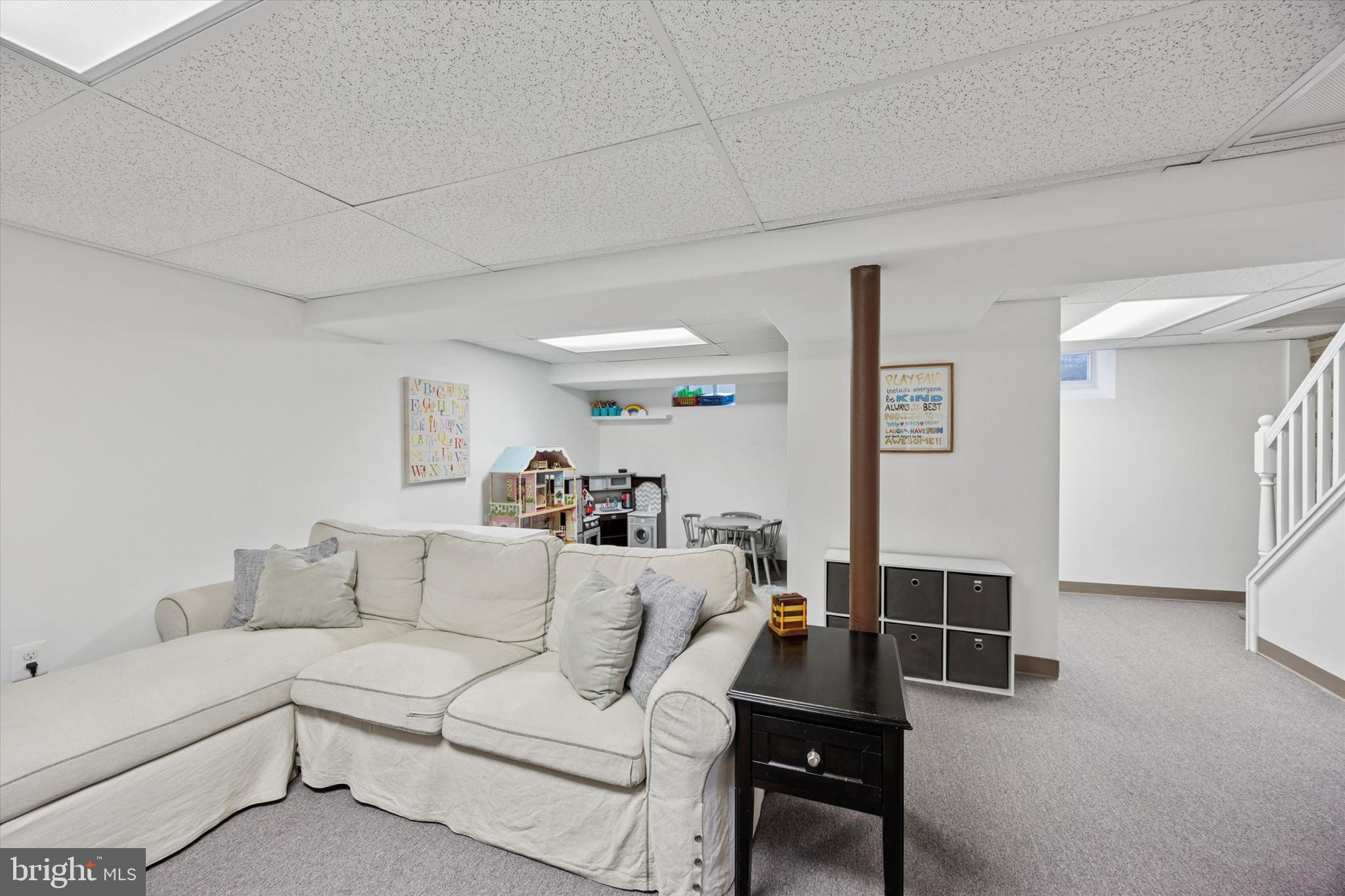 256 Ridgewood Road Springfield, PA 19064 - Photo 16 of 32 a living room with furniture and a couch