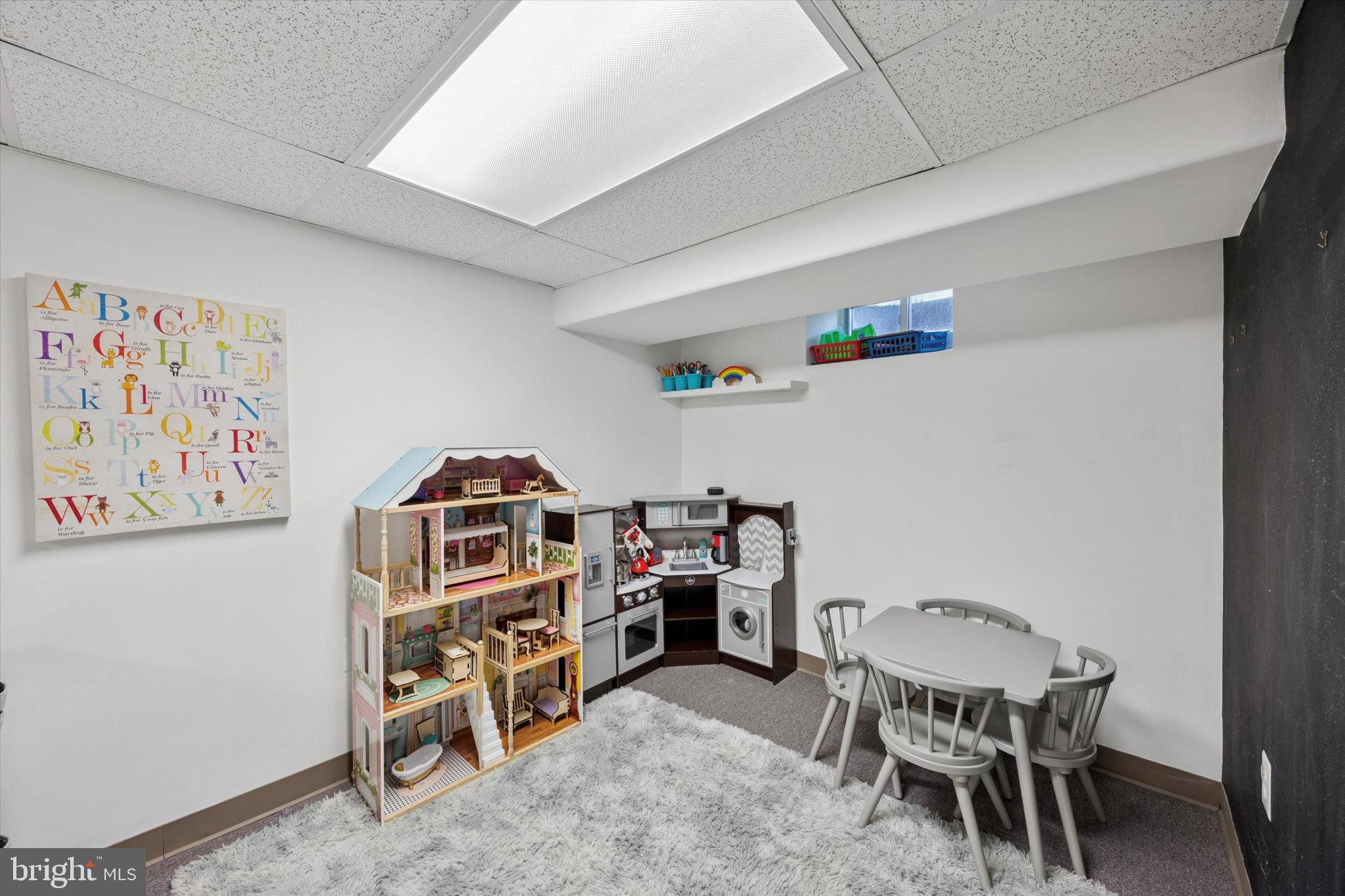 256 Ridgewood Road Springfield, PA 19064 - Photo 17 of 32 a view of a workspace with furniture and toys