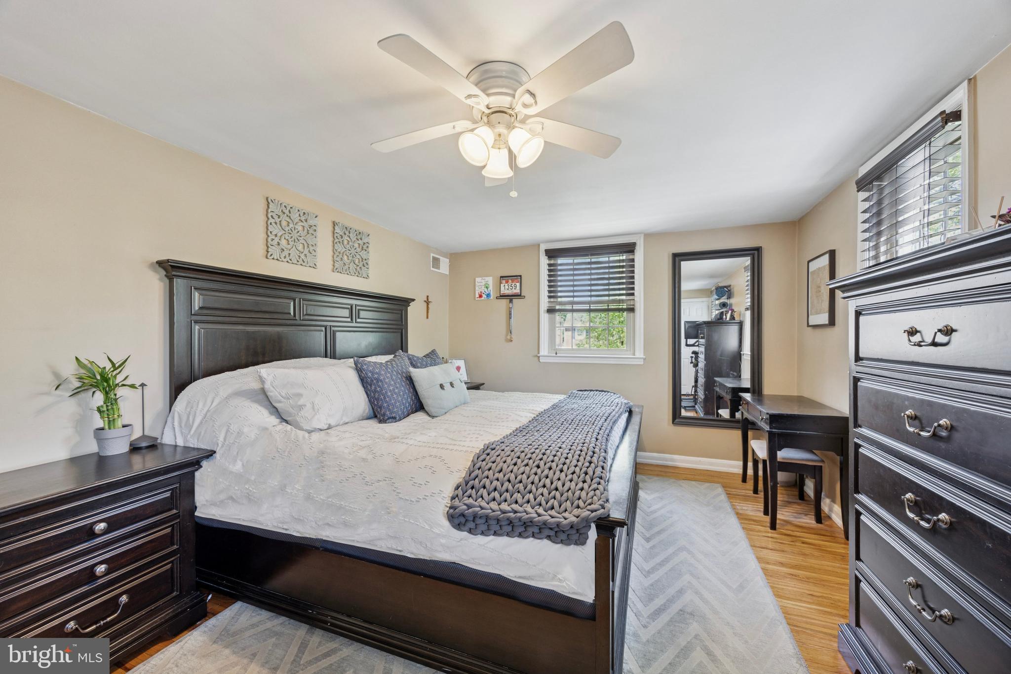 256 Ridgewood Road Springfield, PA 19064 - Photo 19 of 32 a bedroom with a bed and wooden floor