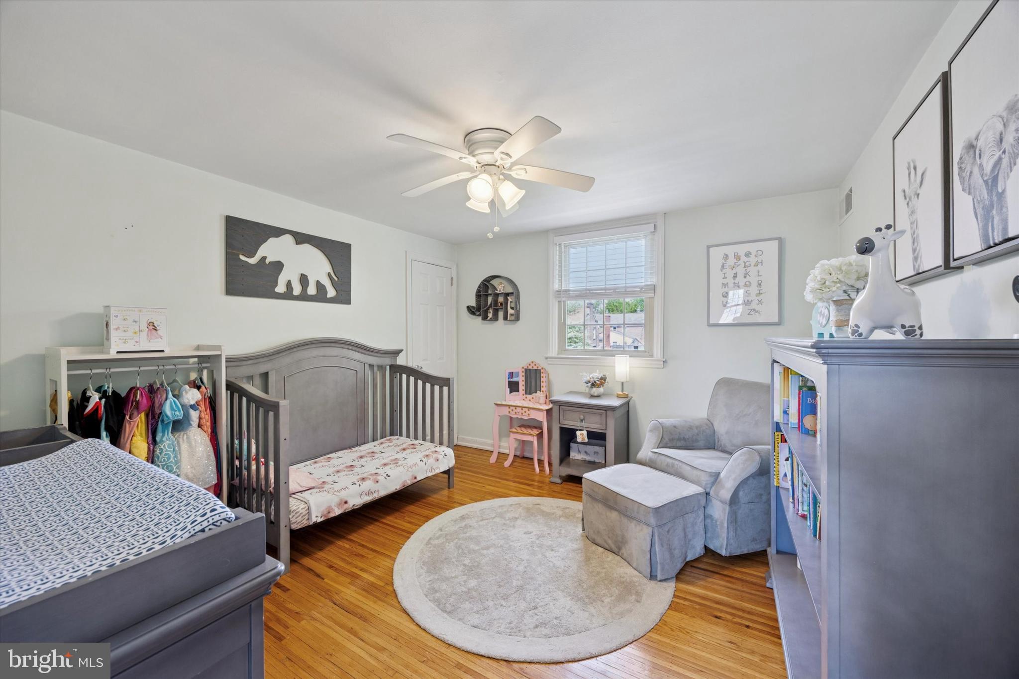 256 Ridgewood Road Springfield, PA 19064 - Photo 21 of 32 a bedroom with furniture and a wooden floor