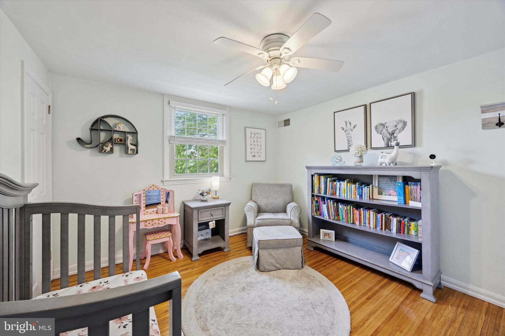256 Ridgewood Road Springfield, PA 19064 - Photo 22 of 32 a living room with furniture and a book shelf