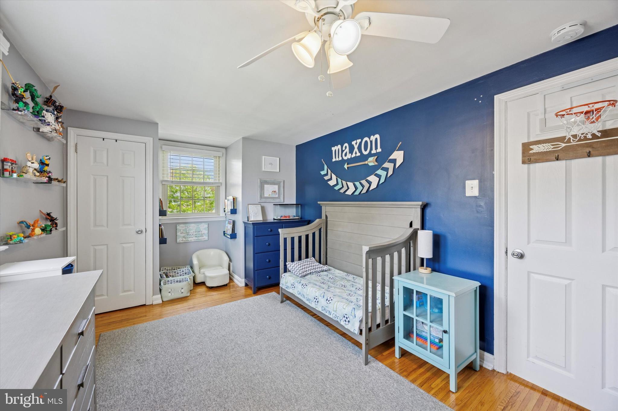 256 Ridgewood Road Springfield, PA 19064 - Photo 25 of 32 a bedroom with furniture and a chandelier