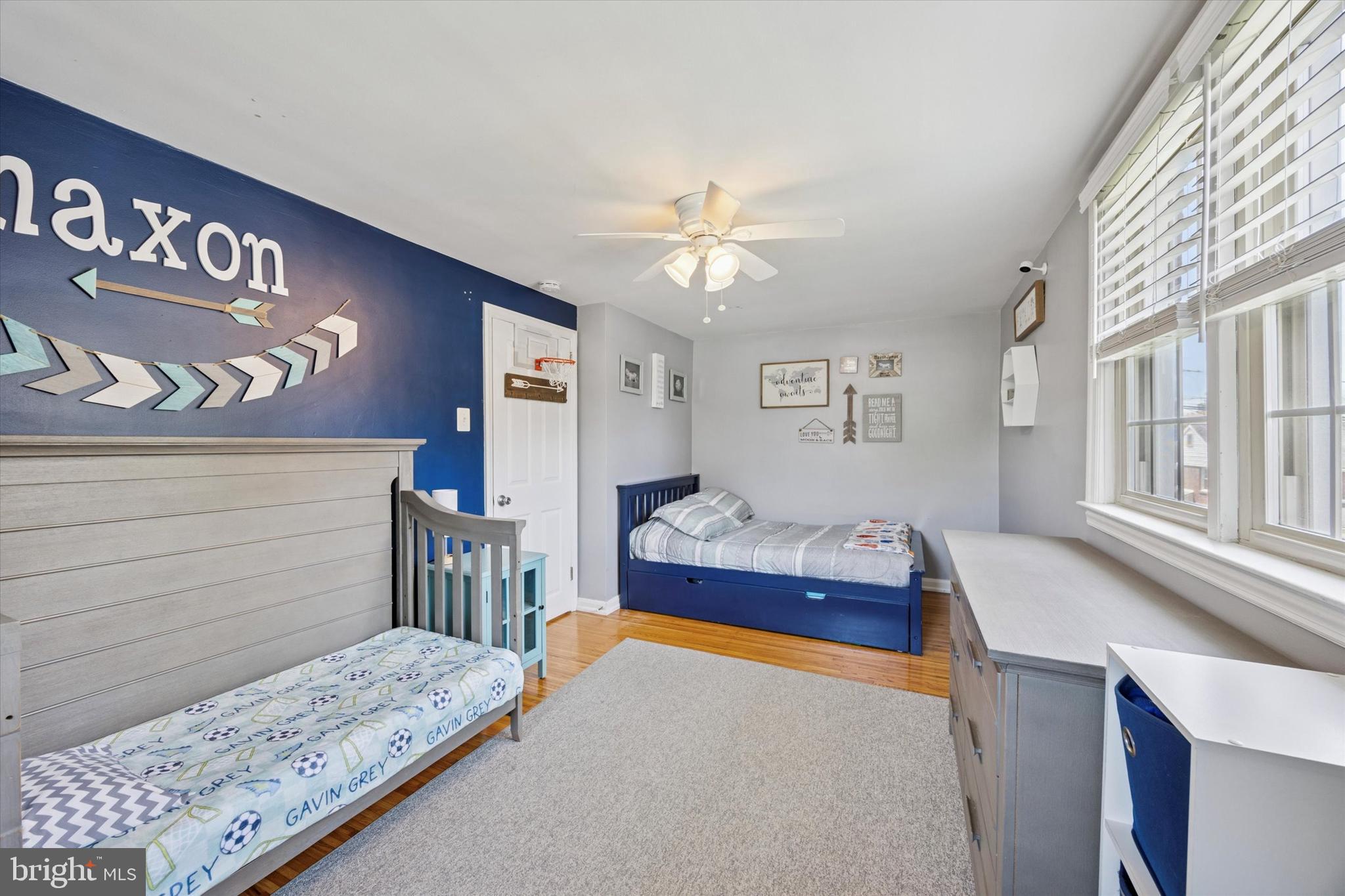 256 Ridgewood Road Springfield, PA 19064 - Photo 26 of 32 a bedroom with a bed and a chandelier