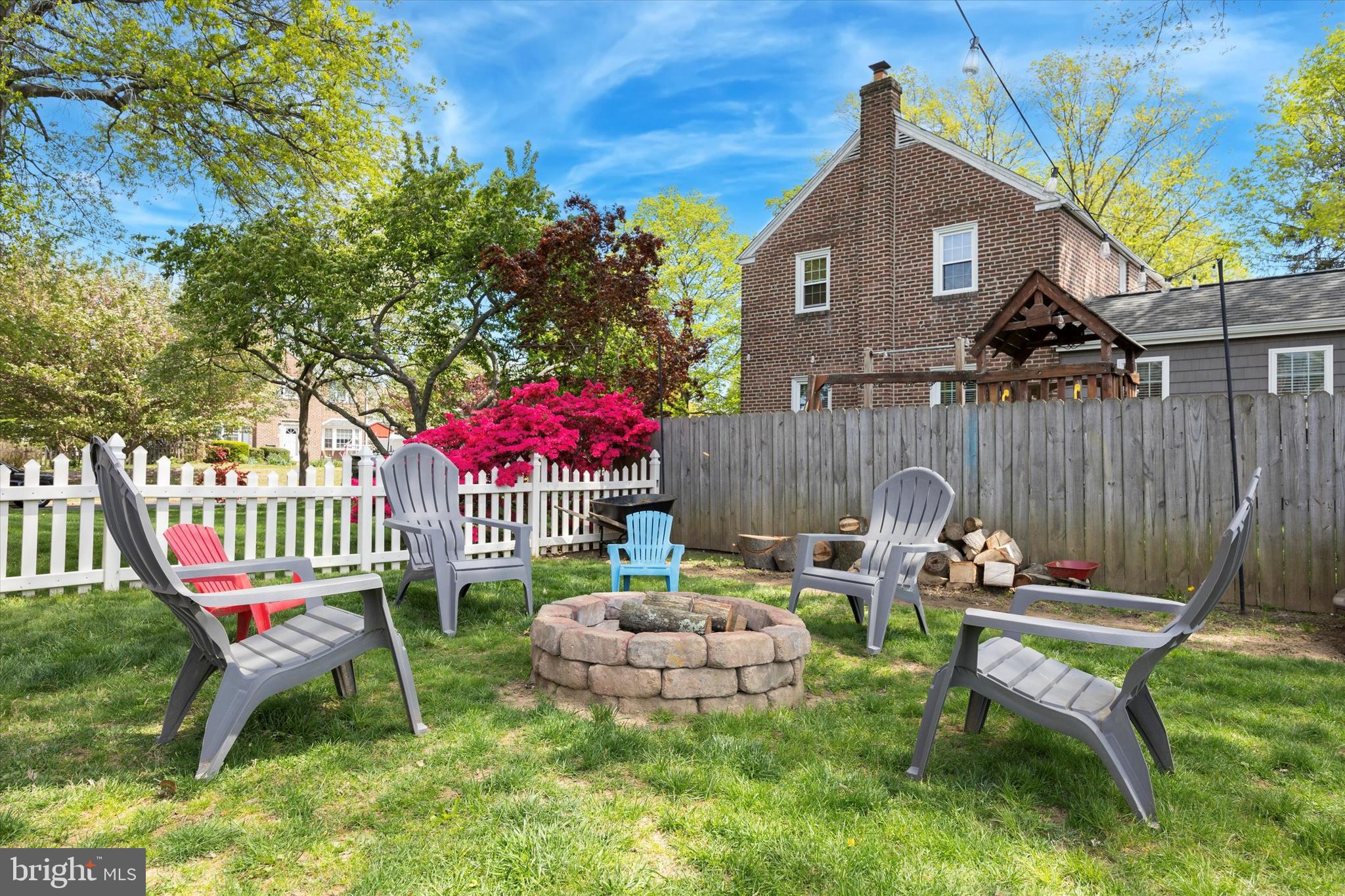 256 Ridgewood Road Springfield, PA 19064 - Photo 30 of 32 a backyard of a house with table and chairs