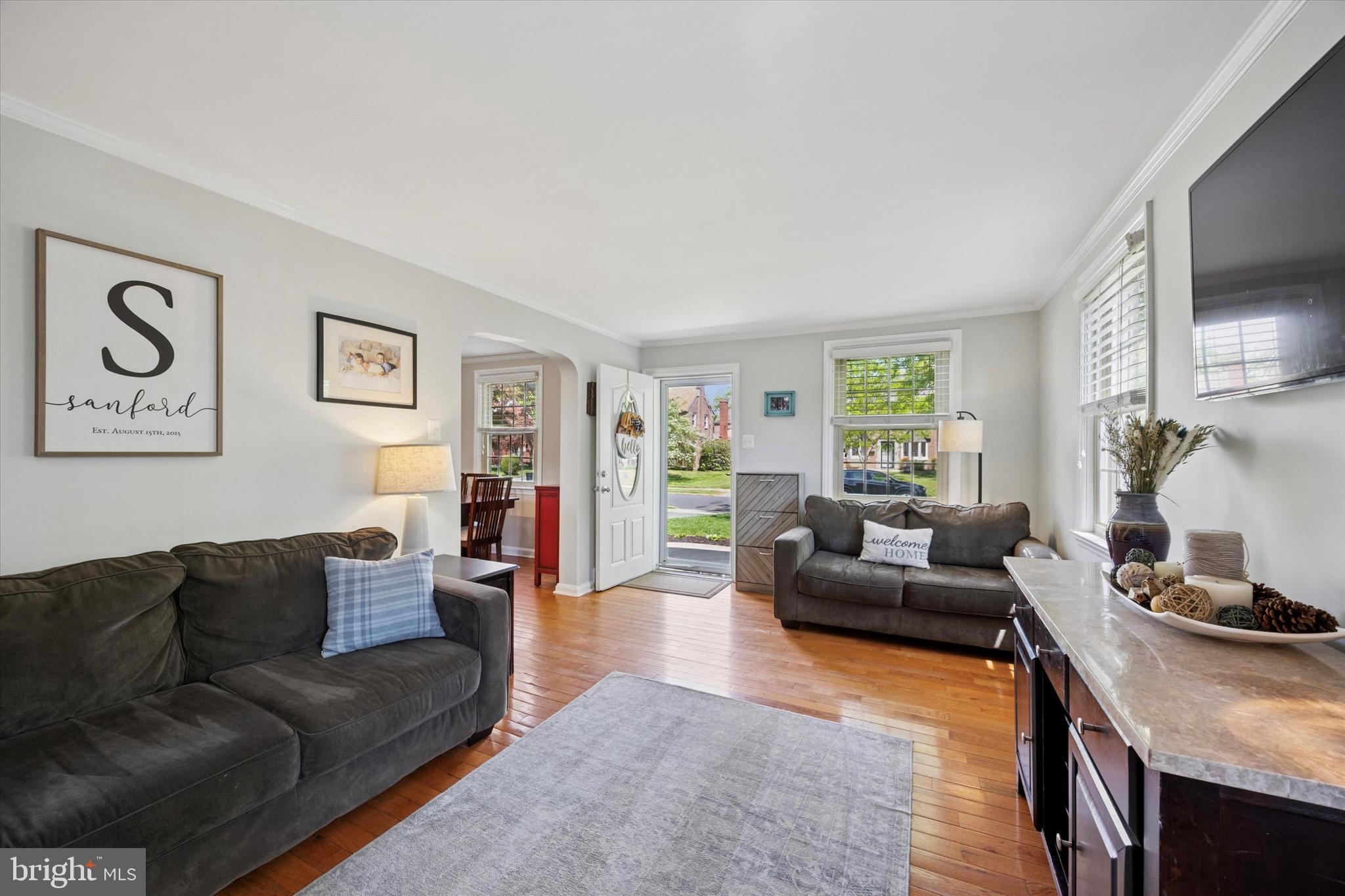 256 Ridgewood Road Springfield, PA 19064 - Photo 6 of 32 a living room with furniture and a flat screen tv