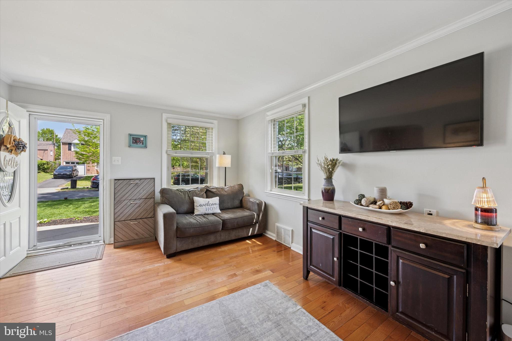 256 Ridgewood Road Springfield, PA 19064 - Photo 7 of 32 a living room with furniture window and a flat screen tv