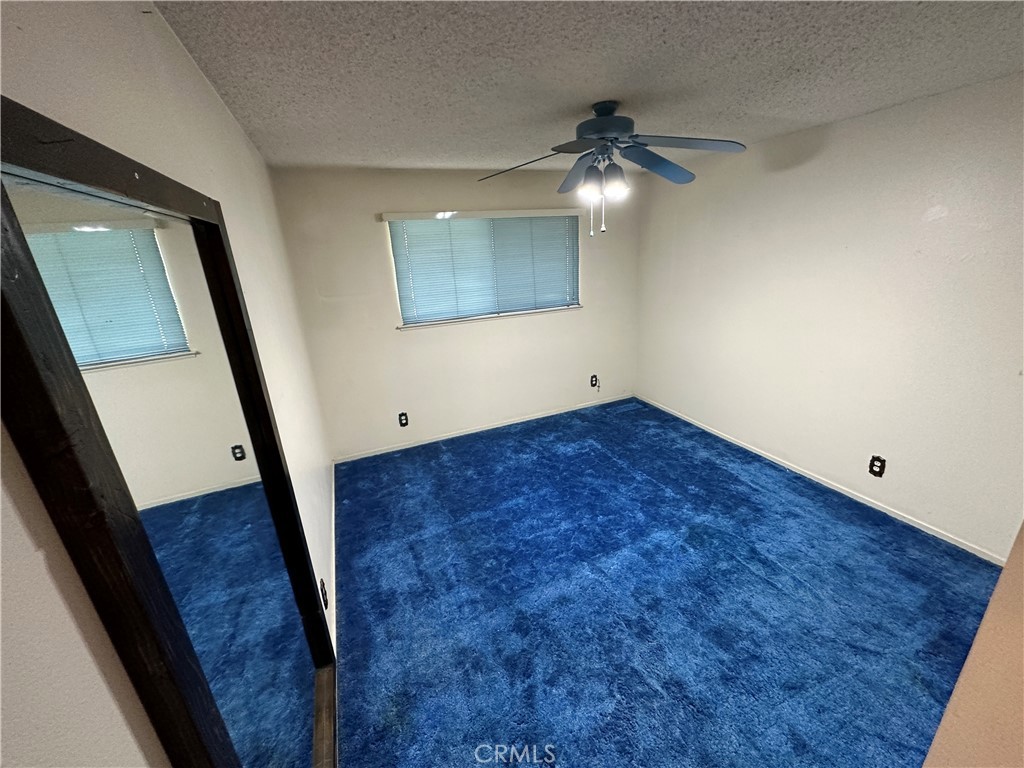 602 Elise Court Merced, CA 95340 - Photo 13 of 20 wooden floor in an empty room with a mirror