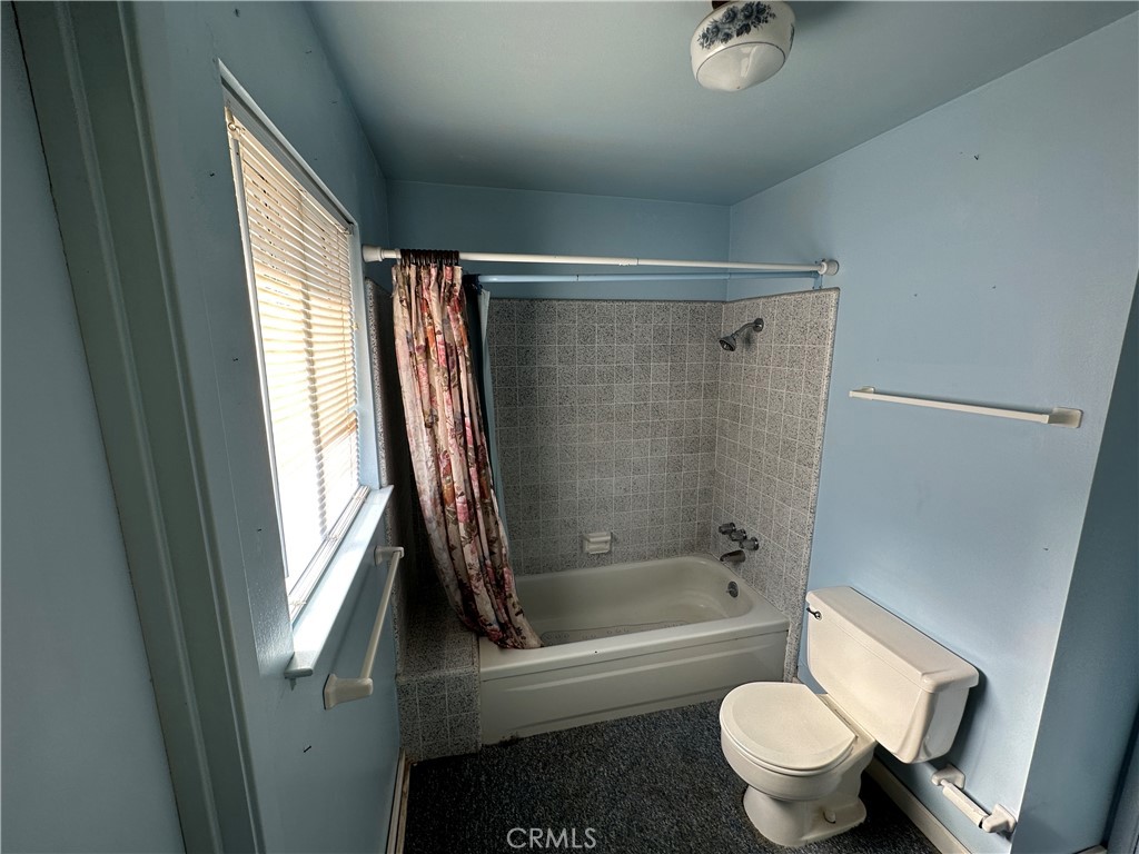 602 Elise Court Merced, CA 95340 - Photo 16 of 20 a bathroom with a granite countertop bathtub shower sink vanity and toilet