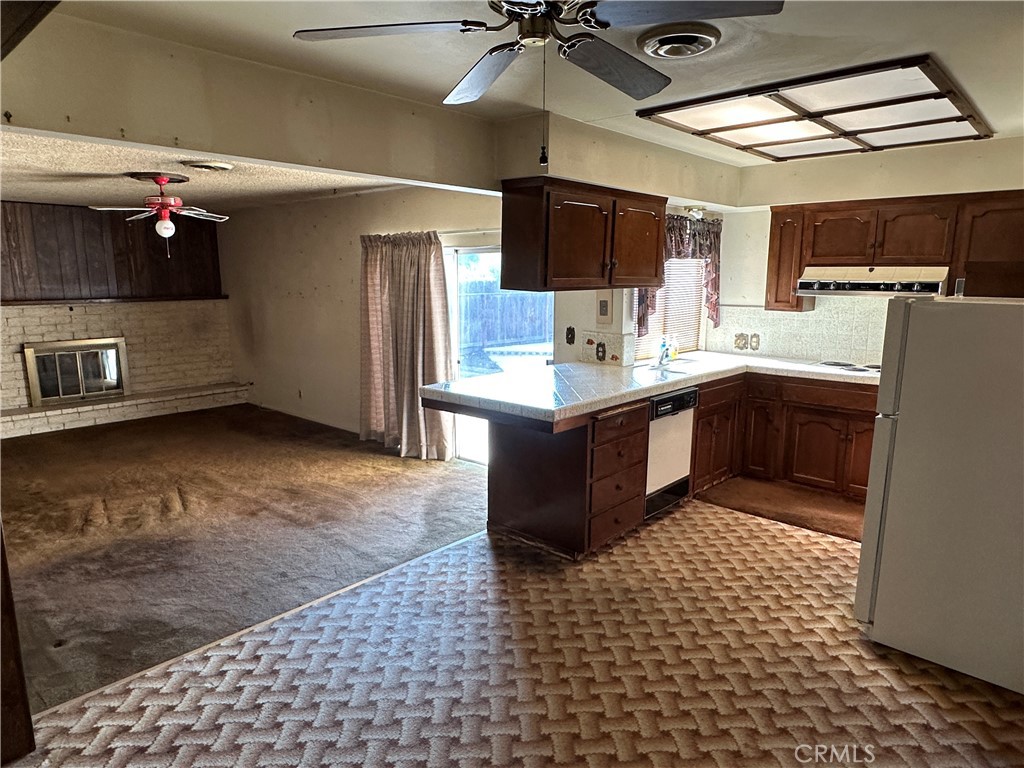 602 Elise Court Merced, CA 95340 - Photo 3 of 20 a kitchen with a sink appliances and cabinets