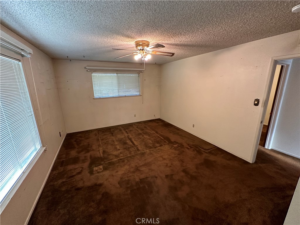 602 Elise Court Merced, CA 95340 - Photo 9 of 20 a view of a big room with closet and wooden floor