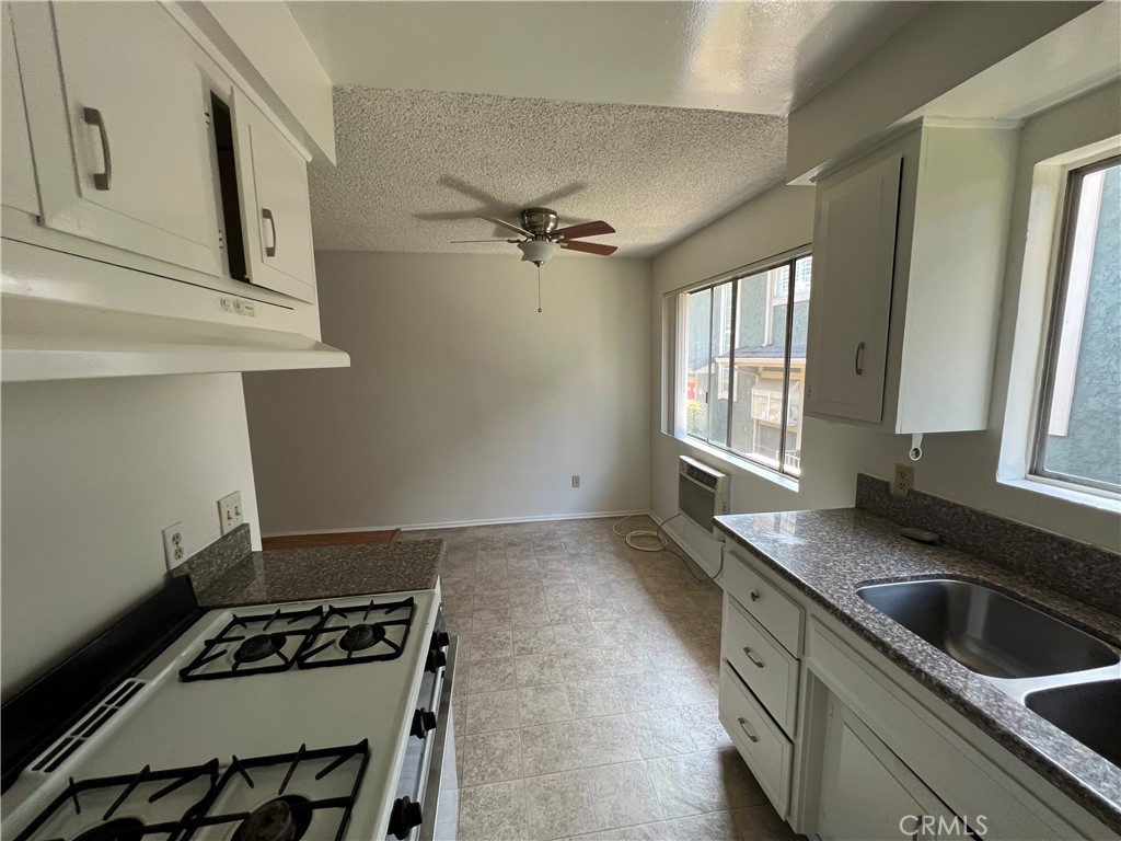 387 North Mentor Avenue, Unit 9 Pasadena, CA 91106 - Photo 3 of 9 a kitchen that has a sink and a stove
