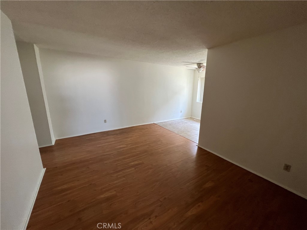 387 North Mentor Avenue, Unit 9 Pasadena, CA 91106 - Photo 5 of 9 an empty room with wooden floor